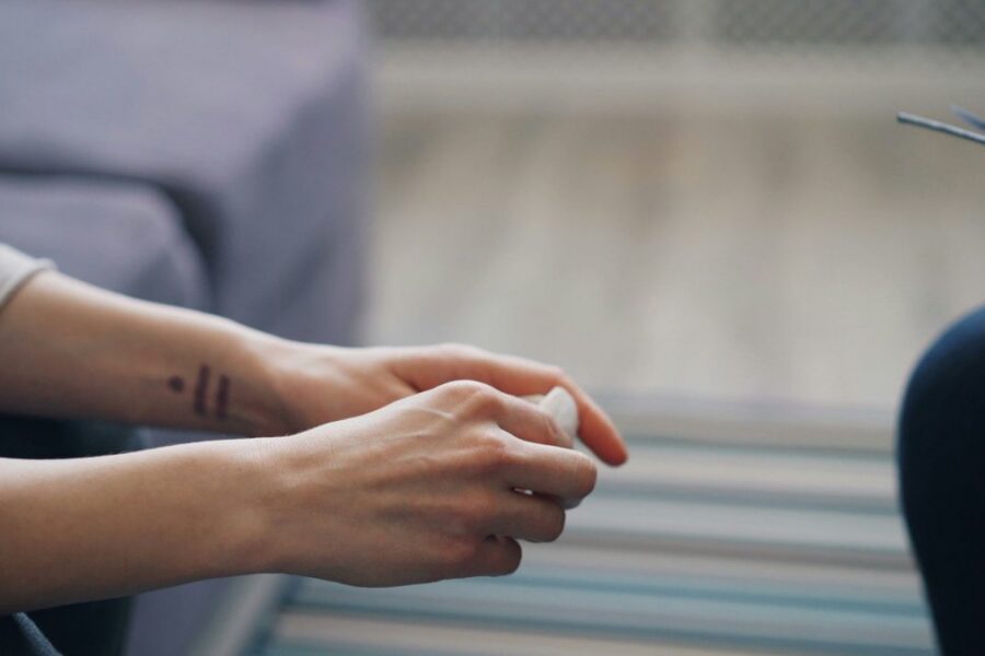 Person in a therapy session, illustrating why therapy alone is not always enough in addiction recovery